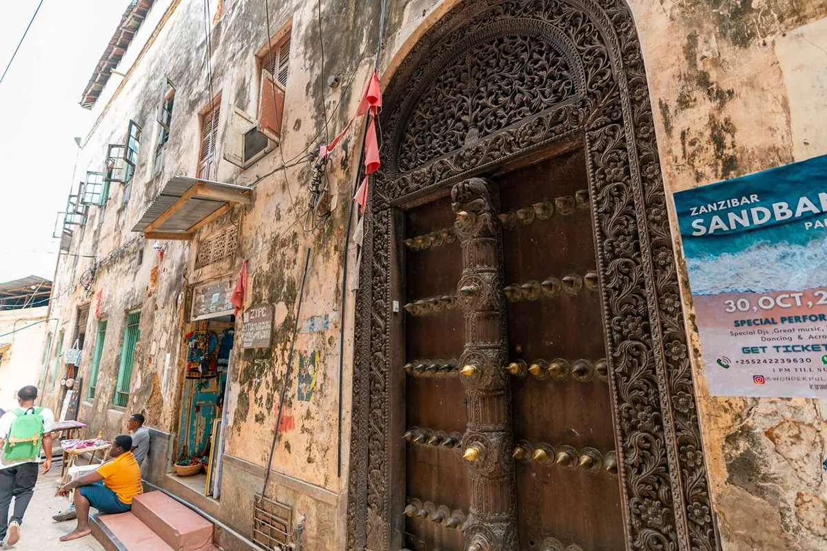 Carved wooden door in the old streets of Stone Town, Zanzibar