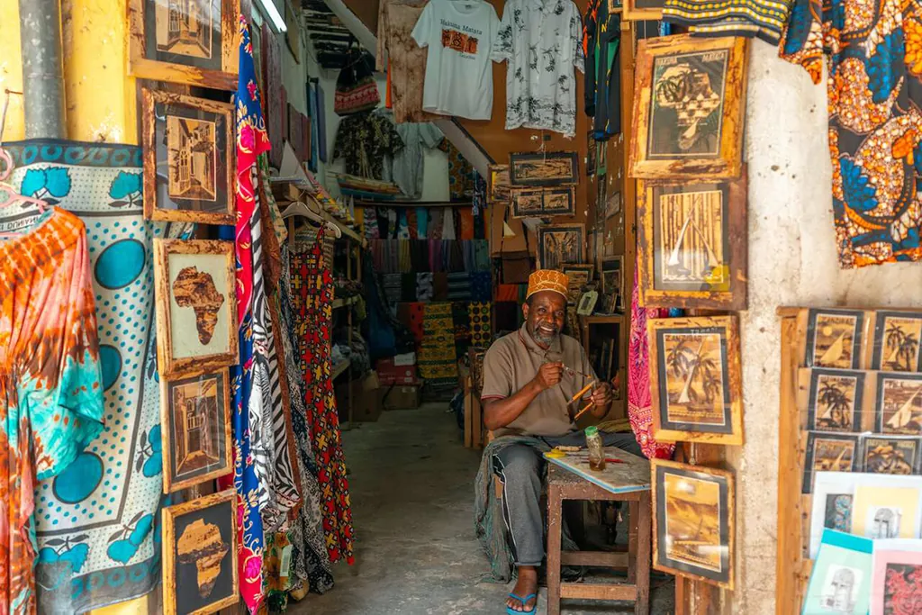 Souvenir shop with paintings and fabrics in Stone Town, Zanzibar