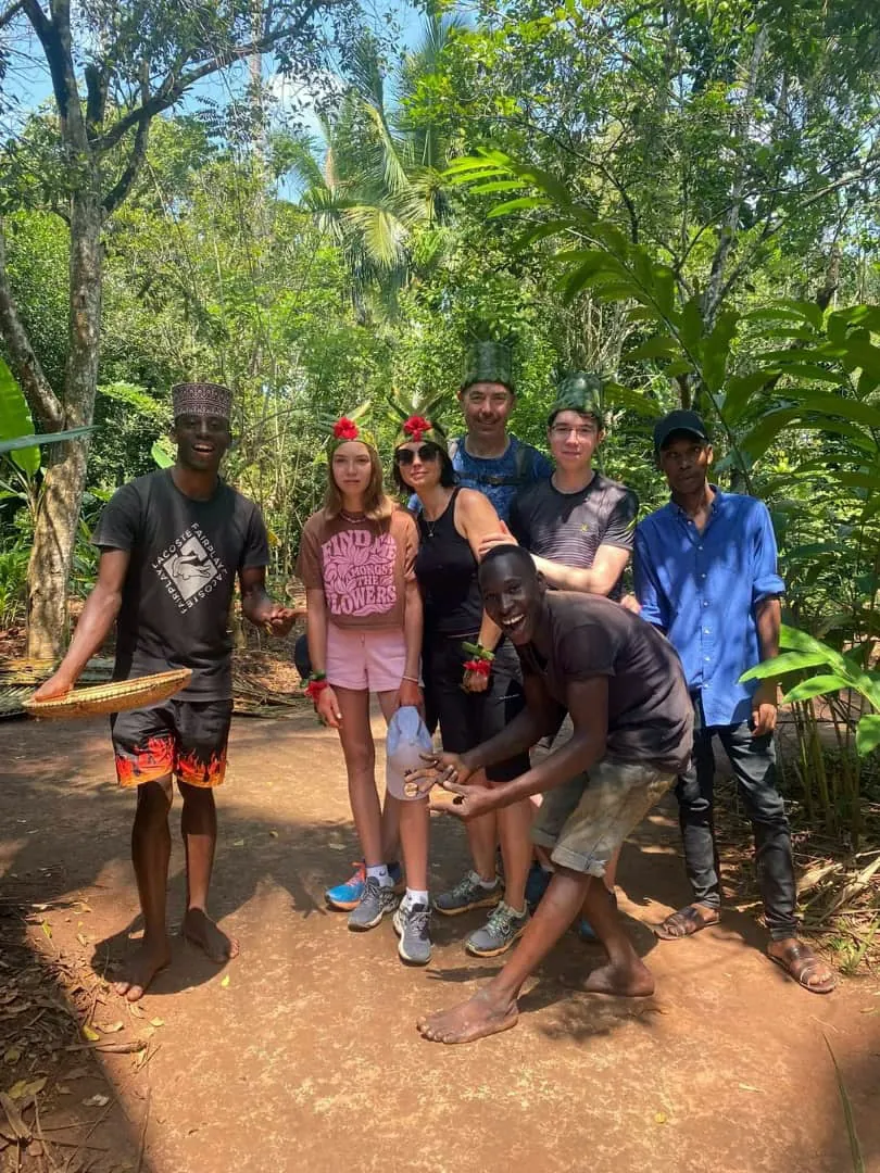 Guests tasting fresh fruit on a spice farm in Zanzibar