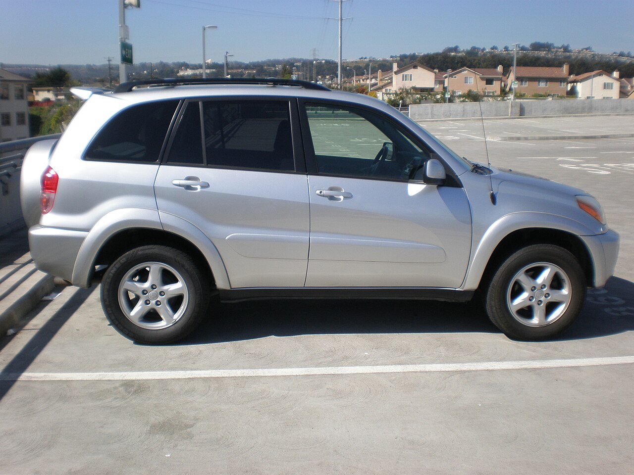 Toyota RAV4 4-door SUV, silver, side view